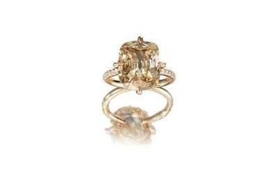A coloured diamond and diamond ring