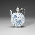 An unusual white-metal mounted blue and white ewer. The porcelain 18th century