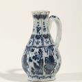 A blue and white small octagonal chinoiserie ewer, marked SVE for Samuel van Eenhoorn, owner of the Greek A factory in Delft 