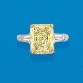 A Fancy Yellow Diamond and Diamond Ring