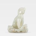 An exceptional white jade carving of a seated mythical beast, Song-Ming Dynasty