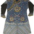 A blue silk ground embroidered dragon robe, Late 19th century