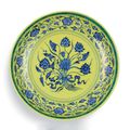 A rare underglaze-blue and yellow-enamelled 'Lotus bouquet' dish, mark and period of Yongzheng (1723-1735)