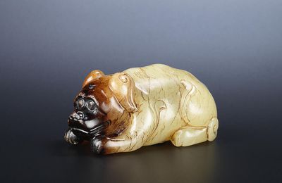 A yellow and russet jade recumbent dog, Ming Dynasty or later