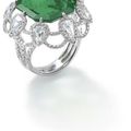 An emerald and diamond ring. 