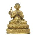 A rare inscribed gilt copper-alloy figure of Tsongkhapa, Tibet, circa 15th century