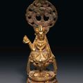 A small gilt-bronze figure of seated Avalokiteshvara, Late Tang dynasty, 8th-9th century