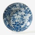 A deep blue and white dish with waved rim, Kangxi six character mark and period (1662-1722)