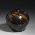 A Cizhou type black glazed stoneware jar with russet decoration. Jin Dynasty