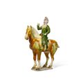 A sancai-glazed figure of an equestrian, Tang dynasty