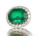 An emerald and diamond brooch/pendant & A pair of emerald and diamond earrings sold @ Bonhams