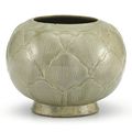 A carved Yue celadon jar, Five Dynasties (907-960)
