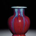 A fine flambé-glazed 'Pomegranate' vase, Qianlong incised six-character seal mark and of the period (1736-1795)