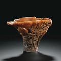 A 'Figural Landscape' rhinoceros horn libation cup by Zhou Wenshu, Qing dynasty, Kangxi period