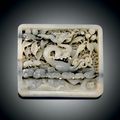 A rare white and grey jade openwork plaque, Yuan dynasty (1279-1368) 