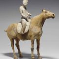 A rare painted grey pottery figure of an equestrian, Tang dynasty (618-907) 