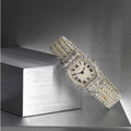 An important Belle Époque seed pearl and diamond lady's wristwatch, Cartier, circa 1913