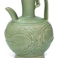 A carved Yaozhou celadon 'peony' ewer, Northern Song dynasty (960-1127)