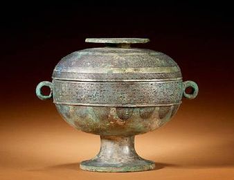 An archaic bronze stem bowl and cover, dou. Warring States Period