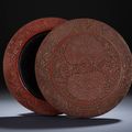 A Yunnan-style carved cinnabar lacquer 'floral' circular box and cover, Ming dynasty, 16th century