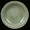 A Longquan Celadon porcelain plate with fishes, China, Yuan Dynasty (1279-1368)