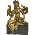 A rare gilt-copper figure of Vasudhara, Nepal, 14th –15th century