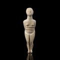 A Cycladic marble female idol, Early Spedos Type, Early Cycladic II, 2700-2500 B.C.