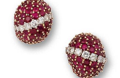 A pair of ruby and diamond earrings, by Cartier