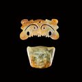 A jade 'toothed animal mask' ornament and a green jade 'face' pendant, Neolithic period, Hongshan culture (c. 3800-2700 BC)