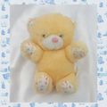 Doudou Peluche Ours Assis Jaune Blanc Fleurs Action Concept Grelot Douni