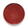A copper-red glazed saucer dish, Kangxi mark and period (1662-1722)