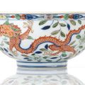 An Imperial Wucai Porcelain Dragon-Phoenix Bowl, China, Yongzheng six-character mark and of the period.