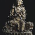 A finely cast lacquer-gilt bronze figure of manjushri (wenshu pusa) on a lion - China, Ming dynasty, 15th/16th Century