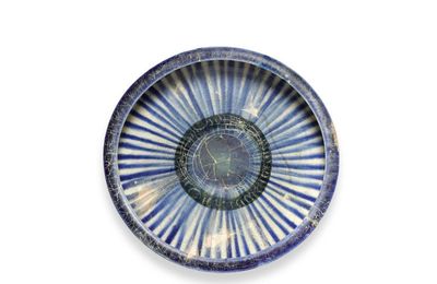 A Kashan blue, black and white conical pottery bowl, Persia, 13th century