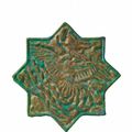 A star-shaped Iranian fritware tile with Lajvardina glaze, late 13th century