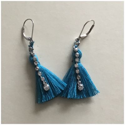 Des boucles d’oreilles blue lagoon et rivière de diamant