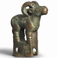 A bronze ram-form yoke ornament, circa 5th-4th century BC