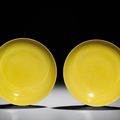 A fine pair of yellow-enamelled saucers, Yongzheng six-character marks within double circles and of the period (1723-1735)