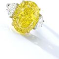 Important Fancy Vivid Yellow Diamond and Diamond Ring