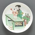 A famille verte enameled porcelain saucer dish & a pair of famille verte export porcelain chargers. Kangxi Period