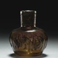 An intact mould-blown glass bottle, Persia, 11th-12th century