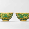 A fine pair of yellow ground green-enamelled 'dragon and phoenix' bowls, Xianfeng six-character marks and of the period