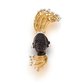 A diamond and eighteen karat gold blackamoor brooch/pendant, Cartier