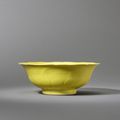 A fine and large lemon-yellow enamelled moulded 'lotus' bowl, Yongzheng six-character mark and of the period (1723-1735)