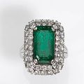 An emerald and diamond ring