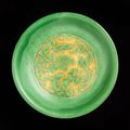 An incised green and yellow 'dragon' dish, Jiajing six-character mark and of the period