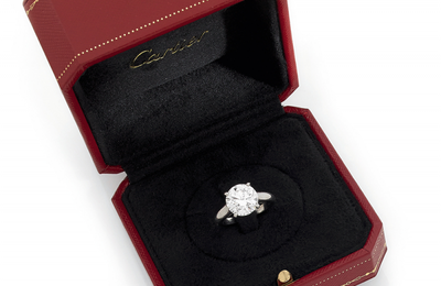 A platinum ring by Cartier set with a brillant-cut diamond weighing 4,02 cts
