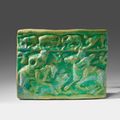 An Iranian fritware tile with a hunting scene, Late 12th century