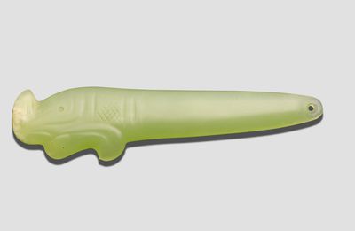 A 'yellow' jade slender tapering jade pendant, Early Shang Dynasty or later