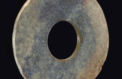 A dark greyish-green jade bi, Northwest China, late 2nd-1st millennium BC